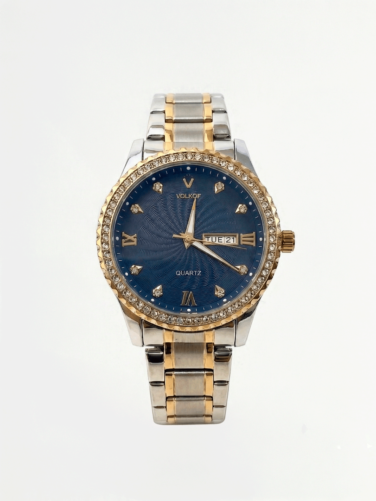 Reloj analógico para hombre en acero inoxidable bicolor plata y oro, con bisel de cristales brillantes, esfera azul oscuro con textura de ondas guilloché, índices de diamante, números romanos y ventana de fecha